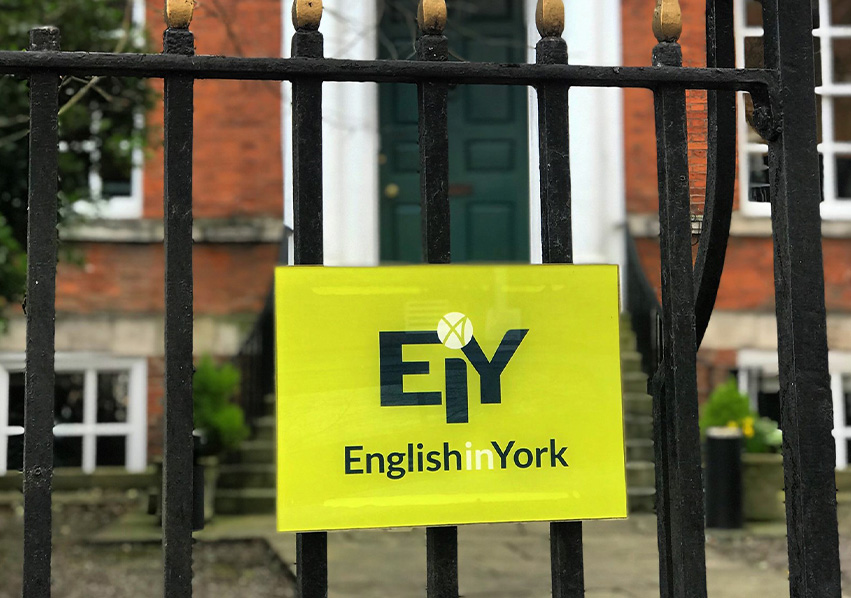 Green sign on gate